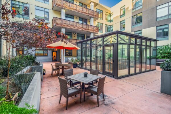 Exterior courtyard photography for senior living marketing media production in Emeryville, CA. Sunroom in courtyard California.