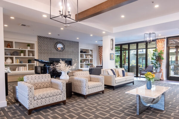 Luxury CCRC Photography of Concierge Seating Area with Piano and Designer Interiors - Keynote Creative Senior Living Media Production