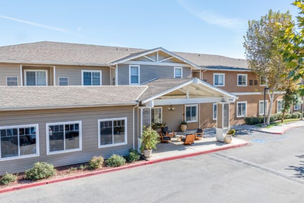Drone Real Estate Phtography for Discovery Senior Living in Riverside, CA. Exterior of building with trees and wide driving paths.